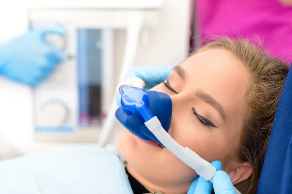 A person recieving sedation prior to dental care.